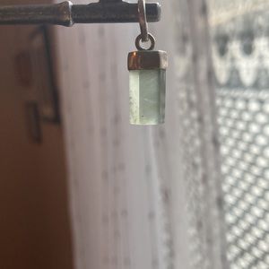 Beautiful, aquamarine pendant set in silver. Crystal with silver cap.